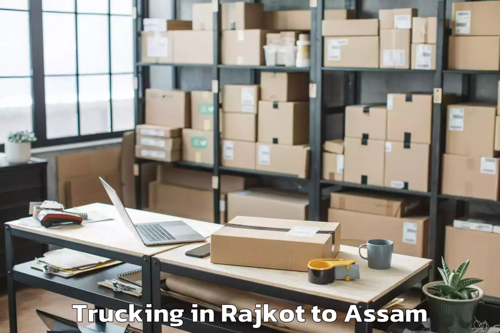 Affordable Rajkot to Raha Gaon Trucking